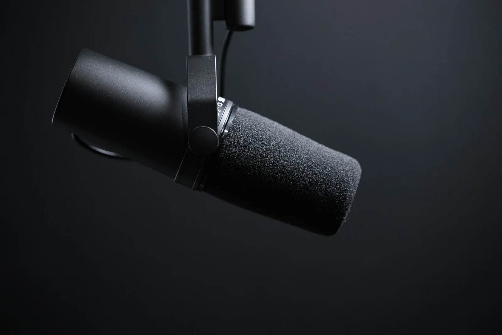 Cinematic close-up of a podcast microphone, illustrative photography
